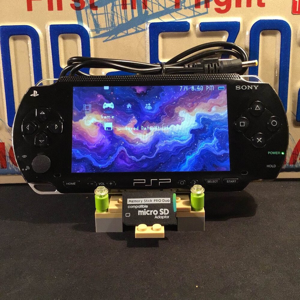 Sony PSP 1001 with Charger, Memory Stick, & Games